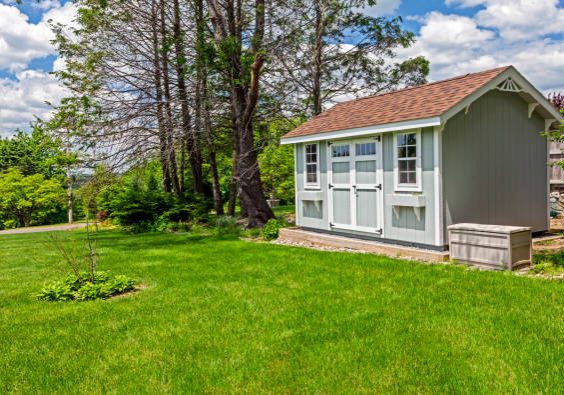 New blue garden shed in beautiful garden New blue garden shed in beautiful garden