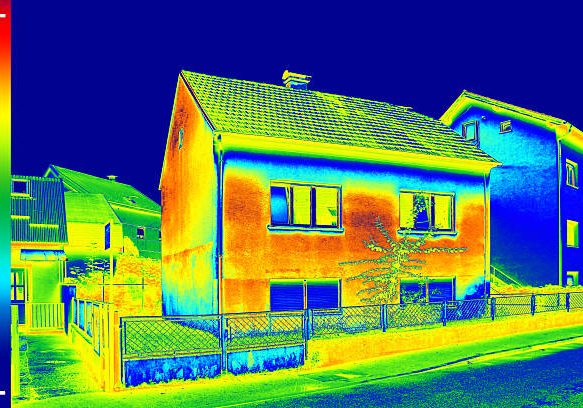 Infrared thermovision image showing lack of thermal insulation on House Infrared thermovision image showing lack of thermal insulation on House